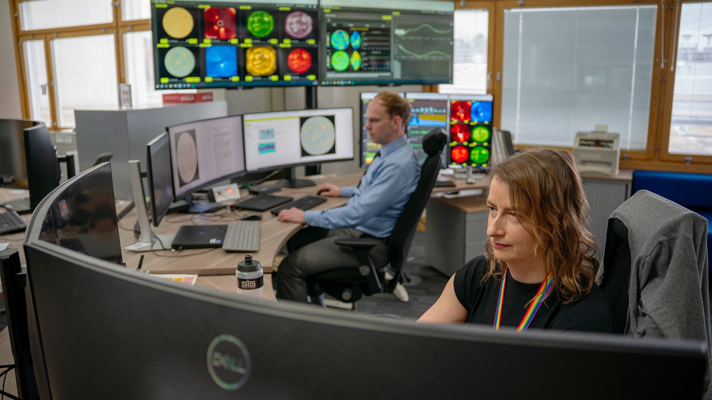 An image showing screens with images of the Sun at the Met Office Space Weather Operations Centre.