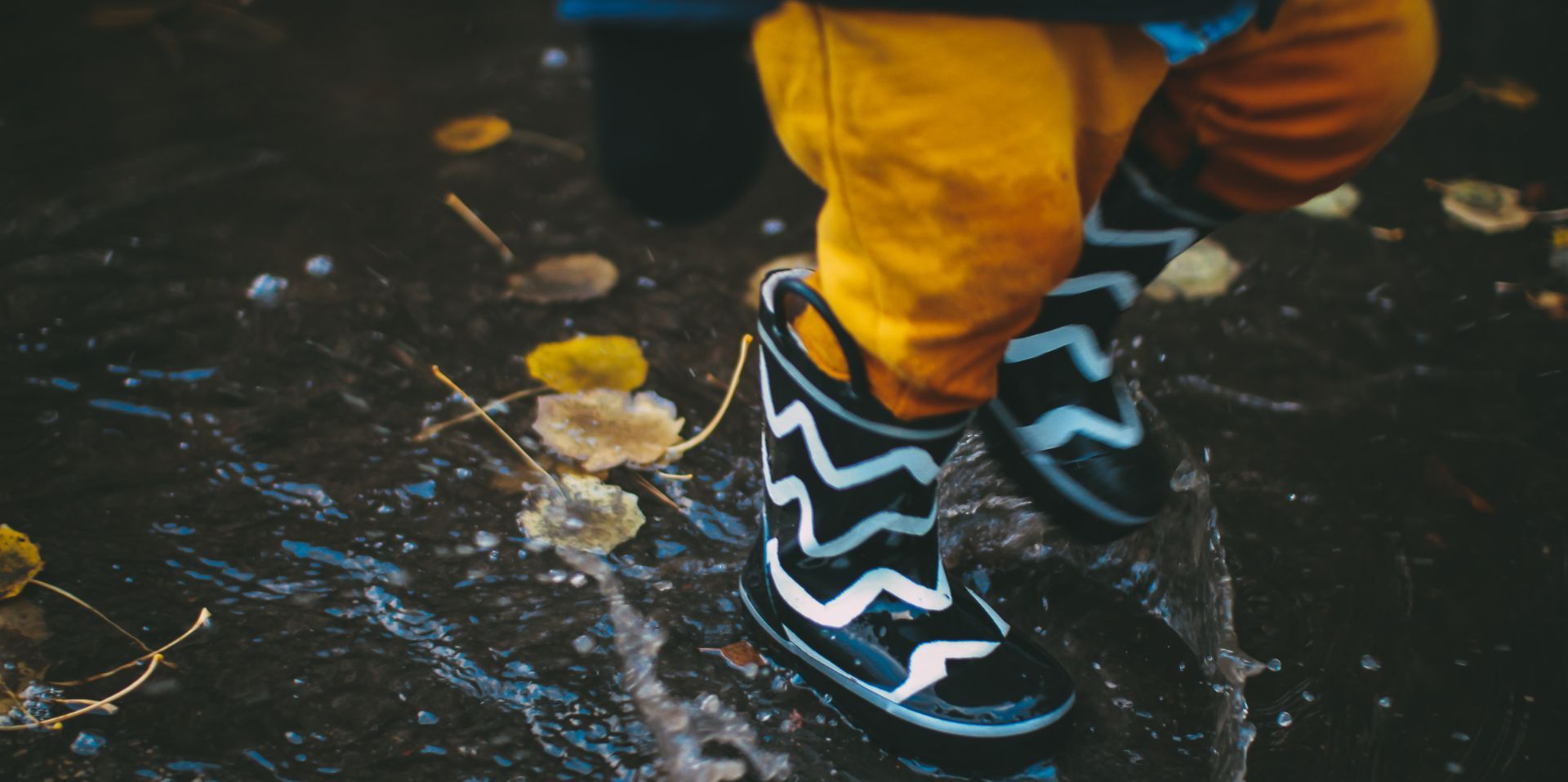 wellies-splashing-in-the-rain.-photo-daiga-ellaby