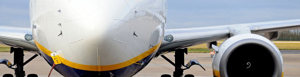 A plane being maintained on the runway of an airport. A plane being maintained on the runway of an airport.