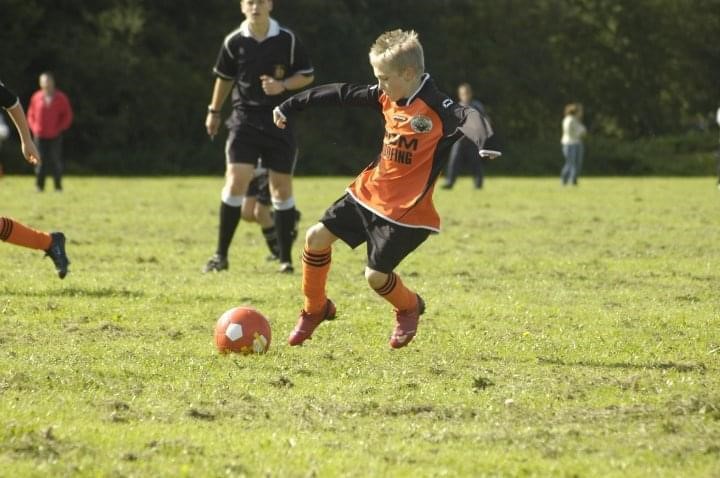 A children's football match.